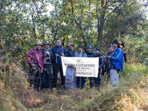 MAPC members holding up the MAPC festoon at Border Pillar 113 at Molvailup