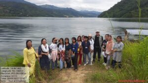 A group photo with students on the bank of the reservoir